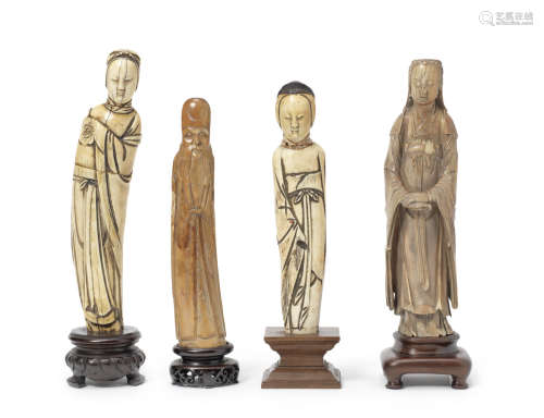 A group of four ivory standing figures