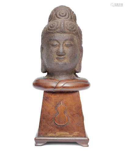 A cast iron head of Guanyin