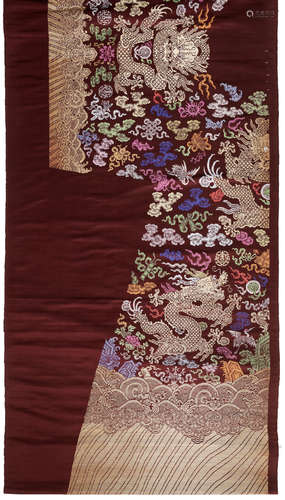 A part-uncut burgundy-ground silk 'dragon' robe