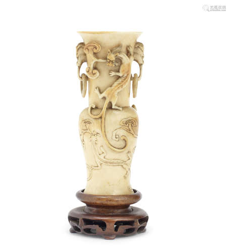 A small carved ivory baluster vase