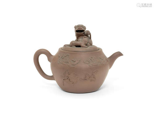 A yixing teapot and cover with applied decoration