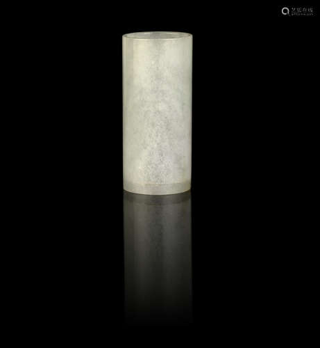 A pale green jadeite cylindrical brushpot