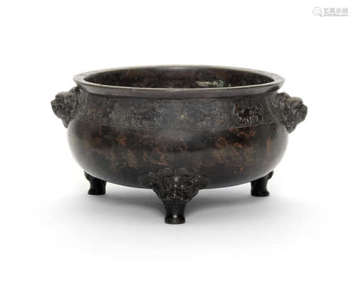 A bronze tripod incense burner