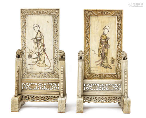 A pair of ivory table screens and stands