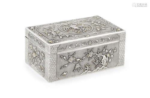 A rectangular silver and gilt box and cover