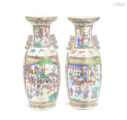 A matched pair of Canton famille rose baluster vases