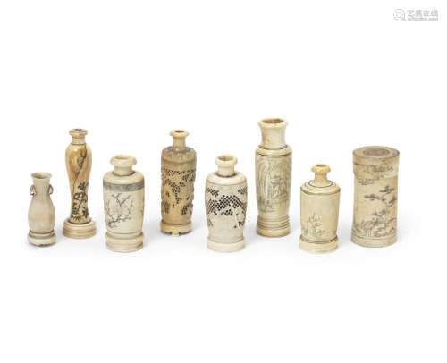 A selection of small ivory 'tool' vases