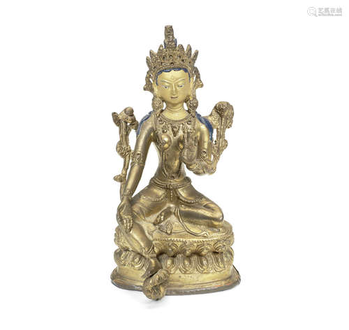 A gilt-bronze figure of Tara