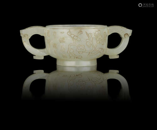 A small pale green jade two-handled cup