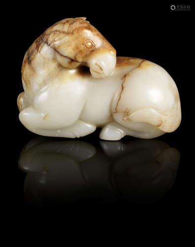 A pale and russet jade carving of a horse