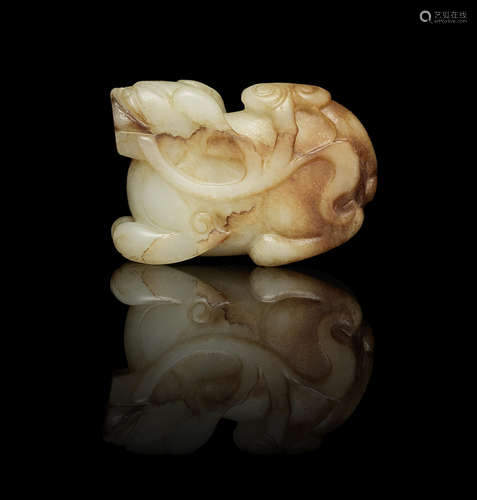 A cream and russet jade carving of a mythical beast