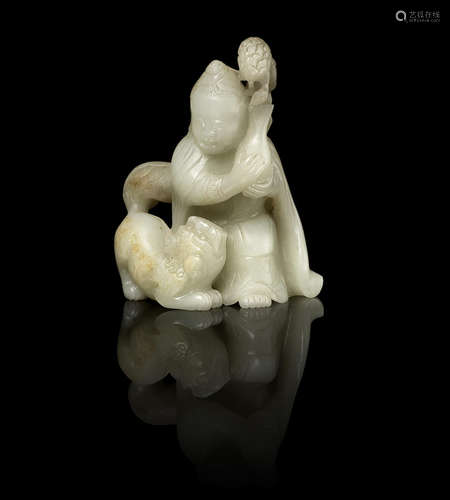 A green jade carving of a Luohan and lion