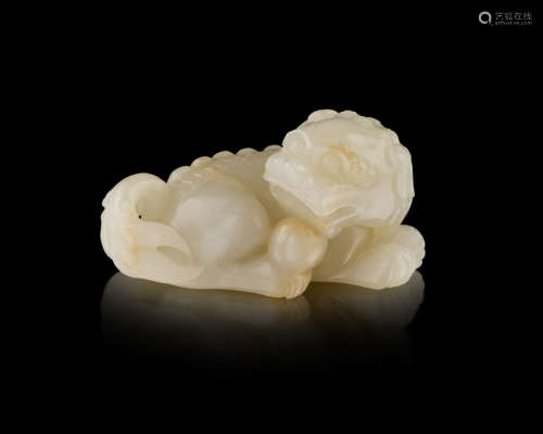 GREYISH-WHITE JADE CARVING OF A BUDDHIST LION QING DYNASTY, 19TH CENTURY