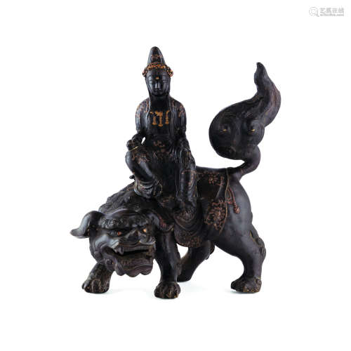 BRONZE FIGURAL GROUP OF GUANYIN ON A BUDDHIST LION MING DYNASTY