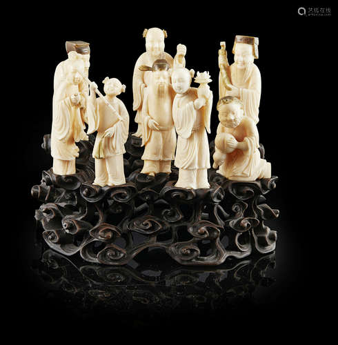 Y SET OF CARVED IVORY FIGURES OF THE EIGHT IMMORTALS LATE QING DYNASTY/REPUBLIC PERIOD tallest