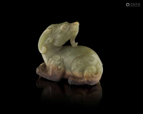 GREEN AND BROWN JADE CARVING OF A RAM QING DYNASTY, 19TH CENTURY