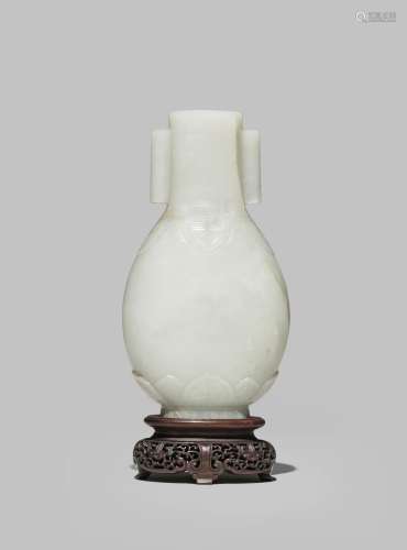 *A CHINESE PALE CELADON JADE TWO-HANDLED VASE