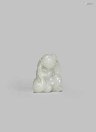 A SMALL PALE CELADON JADE CARVING OF A BOY