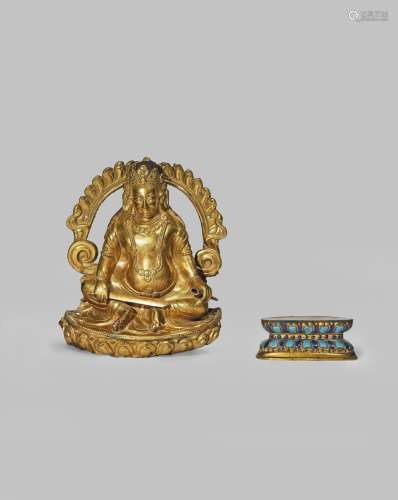 A NEPALESE GILT COPPER MODEL OF A SEATED FIGURE