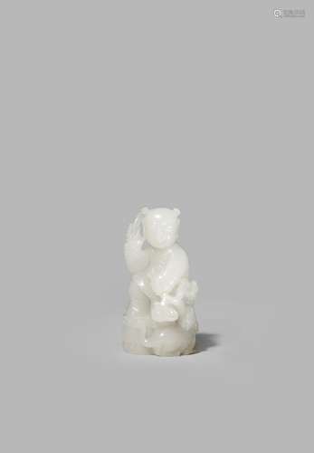 A CHINESE WHITE JADE FIGURE OF A BOY