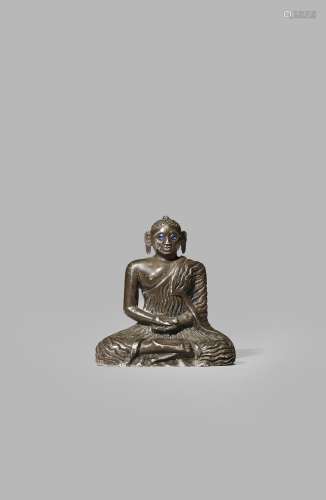 A SMALL SRI LANKAN SILVER FIGURE OF BUDDHA