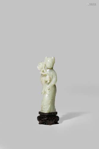 A CHINESE CELADON JADE CARVING OF A YOUNG WOMAN