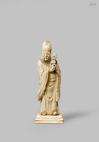 <strong>λ </strong>A CHINESE IVORY FIGURE