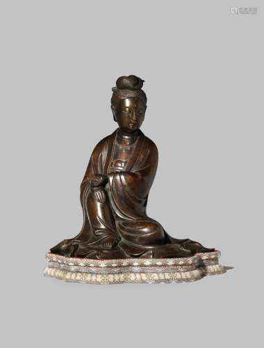 A CHINESE BRONZE MODEL OF GUANYIN