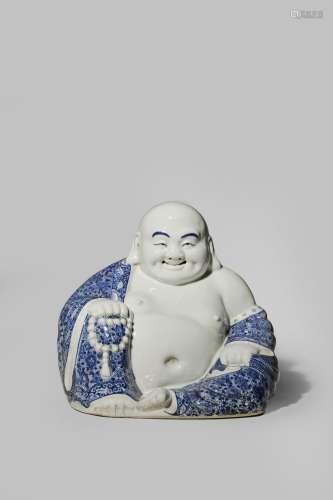 A CHINESE BLUE AND WHITE FIGURE OF BUDAI HE SHANG