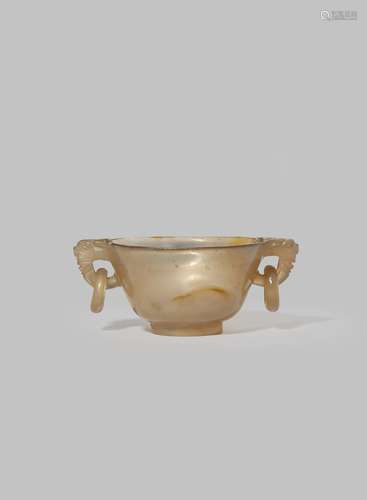 A SMALL CHINESE AGATE TWO-HANDLED CUP