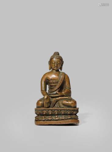A SMALL NEPALESE COPPERY BRONZE MODEL OF BUDDHA