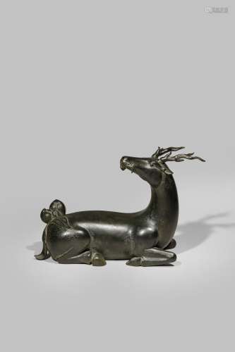 A LARGE CHINESE MING-STYLE BRONZE MODEL OF A DEER
