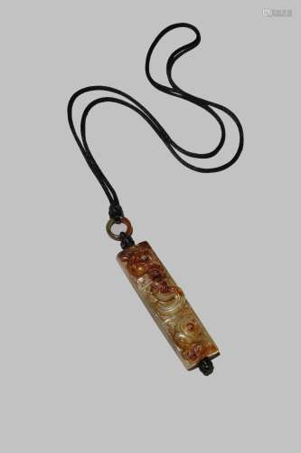 A CHINESE CELADON AND RUSSET JADE ARCHAISTIC PENDANT