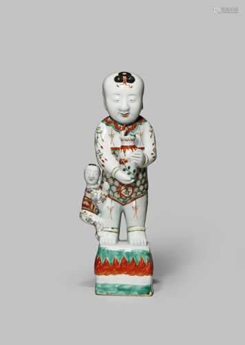 A LARGE CHINESE WUCAI FIGURE OF A BOY