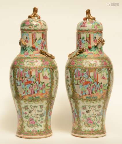A pair of Chinese Canton vases with relief decoration in the shape of dragons, 19thC, H 67 - 68 cm (one vase with restoration on the neck)