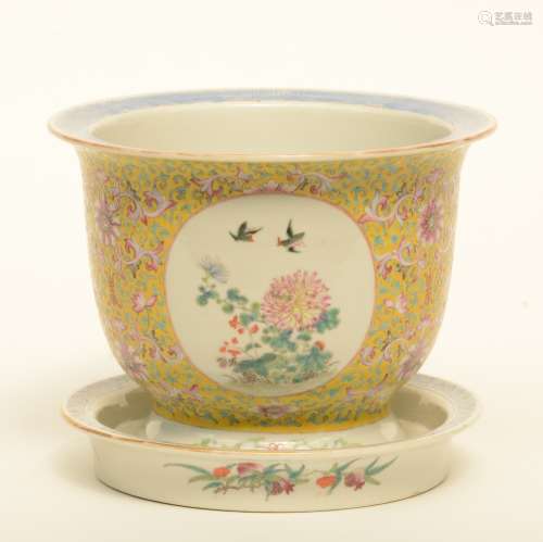 A Chinese famille rose and floral decorated cachepot in yellow background with matching plate, H 19 - Diameter 25 - 24 (plate) cm (crack on the bottom of the cachepot)