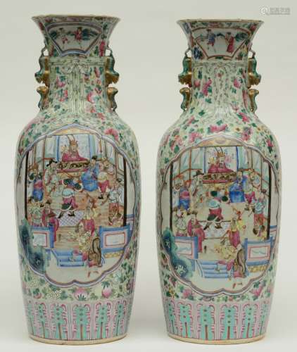 An exceptional pair of Chinese famille rose vases decorated with a court scene and warriors, profiled neck and relief decoration, 19thC, H 62 - 62,5 cm