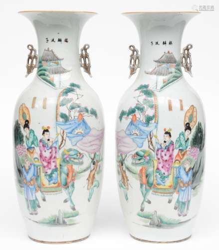 A pair of Chinese polychrome vases, depicting an animated scene, 19th C, H 58 cm, (minor hairline on the bottom rim)