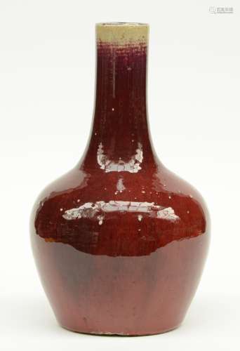 A Chinese sang de boeuf bottle vase, H 38,5 cm (chips on the bottom and a firing fault on the rim)