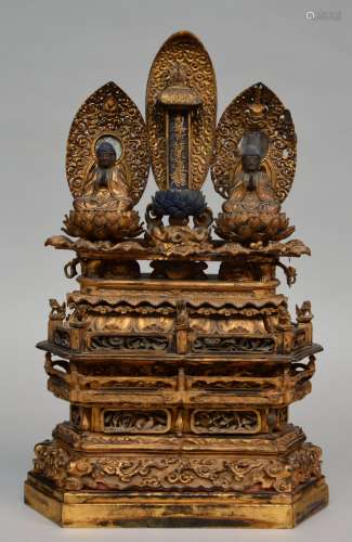 An 18thC Oriental gilt wooden temple with two sitting Buddha's on lotus seat and rich carvings, H 60 - W 39 cm (minor restoration)