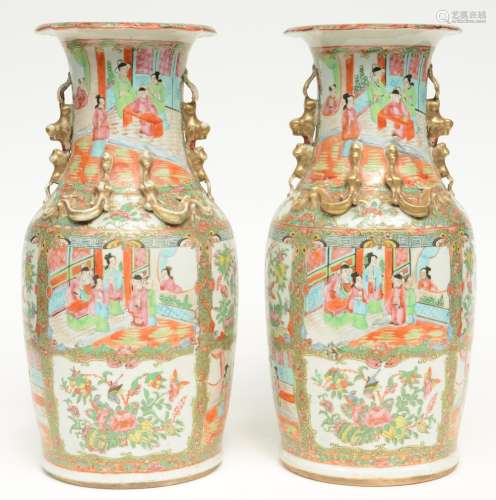A pair of Chinese Canton vases with relief decorations, 19thC, H 45,5 cm (one vase with minor chip, other vase with minor hairline on the relief decoration)