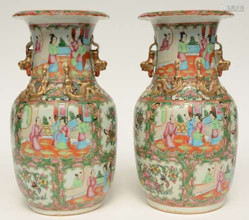 A pair of Chinese Canton vases with relief decorations, H 35,5 cm (one vase with chip on the rim; added a ditto pair, H 35 cm (one vase with hairline in the neck and crack on the bottom)