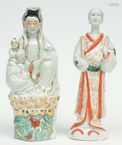 A Chinese polychrome decorated figure of a Guanyin with child sitting on a lotus, marked, 19thC, H 35 cm; added Japanese polychrome decorated figure of a dignitary, H 35,5 cm