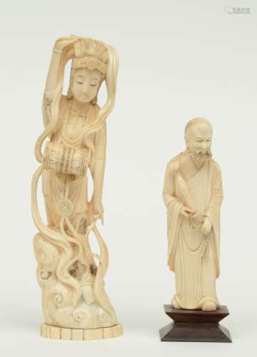A Chinese ivory sage bearing a ruyi scepter, discrete scrimshaw decoration, late Qing dynasty; added a Chinese ivory drum playing godess, slightly scrimshaw decorated, early Republic, H 17,8 (sage) - 27,4 cm (godess) , Weight: ca. 293 (sage) - 694 g (godess) (without base) (godess with damaged and some missing scarf ends) 
