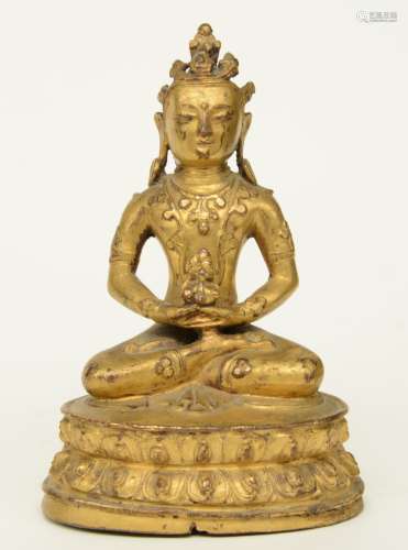 An Oriental gilt bronze Buddha, H 14,5 cm