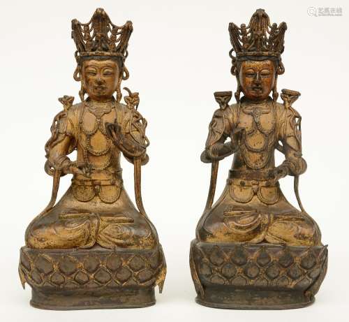 A pair of Chinese gilt and polychrome decorated bronze Buddhas, 18thC, H 36 cm (minor damage and some missing  parts)