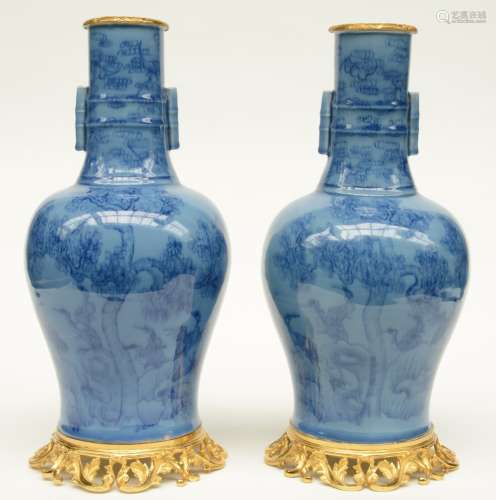 A pair of Chinese baluster shaped vases, blue monochrome ground, decorated with cranes and flower branches, with gilt mounts, H 48,5 cm
