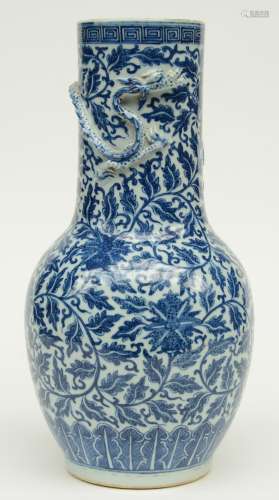 A Chinese blue and white and relief decorated vase, 19thC, H 44,5 cm (crack and whole in the bottom, firing faults and chips)