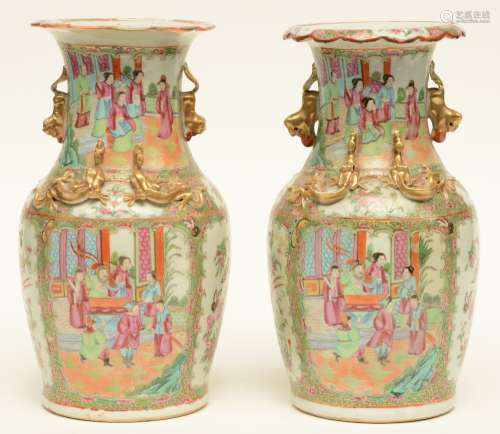 A pair of Chinese Canton vases, relief decorated, 19thC, H 35 cm (one vase with damage on the relief decoration and chip)