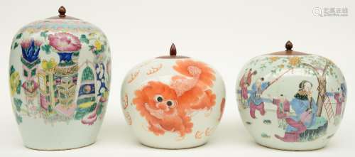 Two Chinese famille rose ginger pots, one decorated with antiquities, one with an animated scene, 19thC; added one Chinese iron-red ginger pot with Fu lions, H 18,5 - 26,5 cm (chip on the top rim)